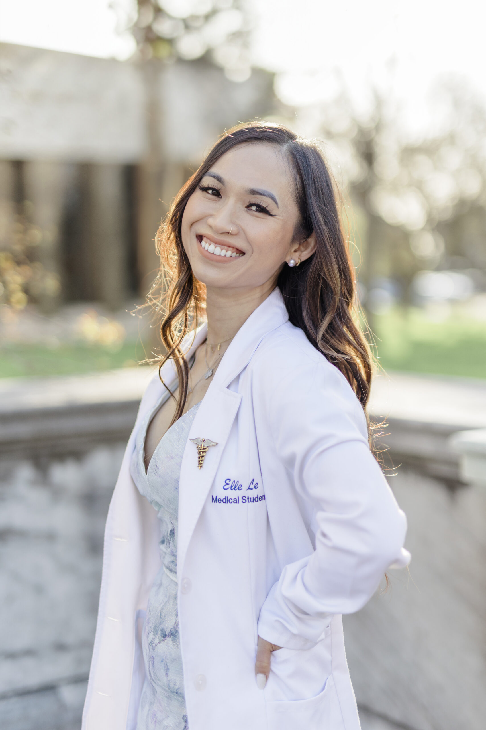 Professional Headshot Photo of a female doctor. She looks friendly and kind.